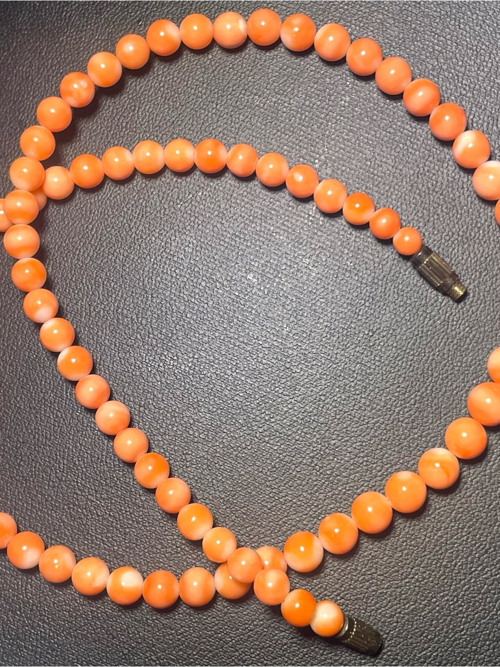 Natural angel skin coral necklace on vintage brass screw clasp.